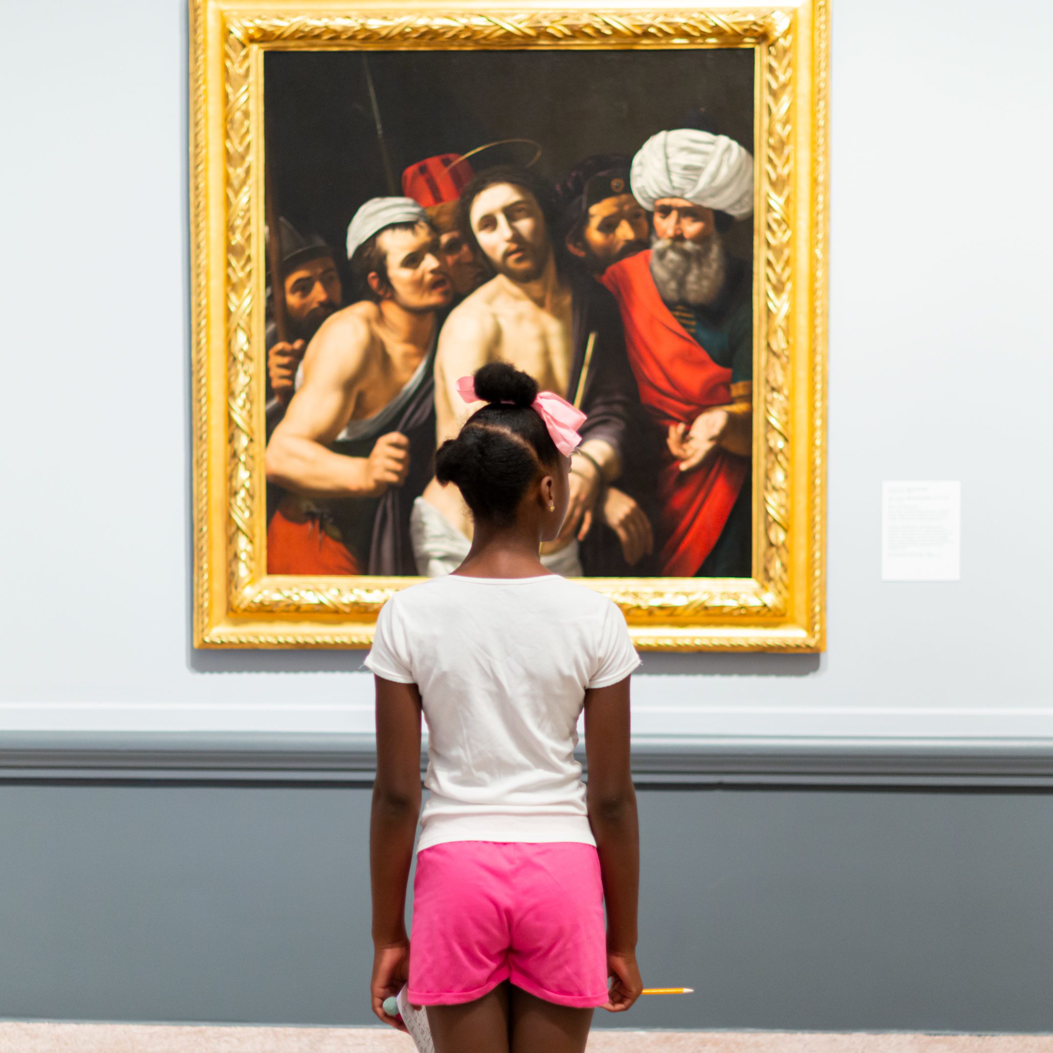 Child looking at art